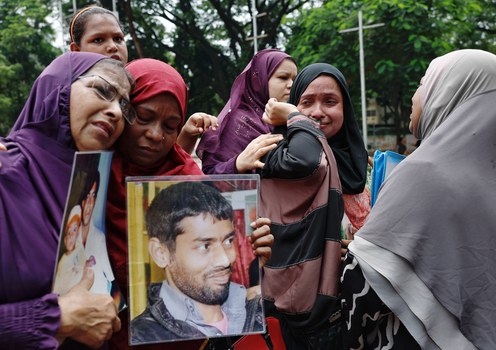 Relatives of people who disappeared during the Awami League government headed by deposed Prime Minister Sheikh Hasina, mourn as they demand justice, Shaheed Minar, Dhaka, Aug. 11, 2024.