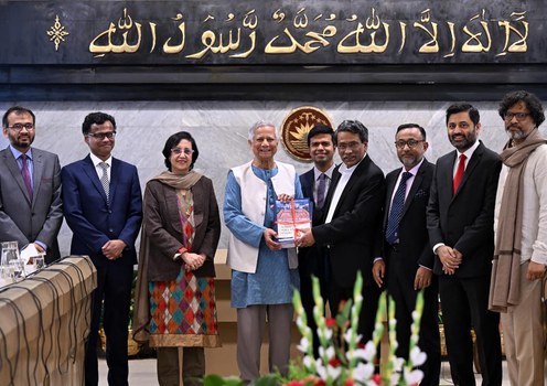 Ali Riaz (fourth from left), head of the Constitution Reforms Commission and a political science professor in the United States, presents to the Bangladesh interim government head, Chief Adviser Muhammad Yunus (fourth from left), a set of proposals to democratize the country’s constitution following the ouster of former Prime Minister Sheikh Hasina, at the chief adviser’s office in Dhaka, Jan. 15, 2024.